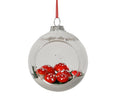 Mushrooms in snow in glass bauble