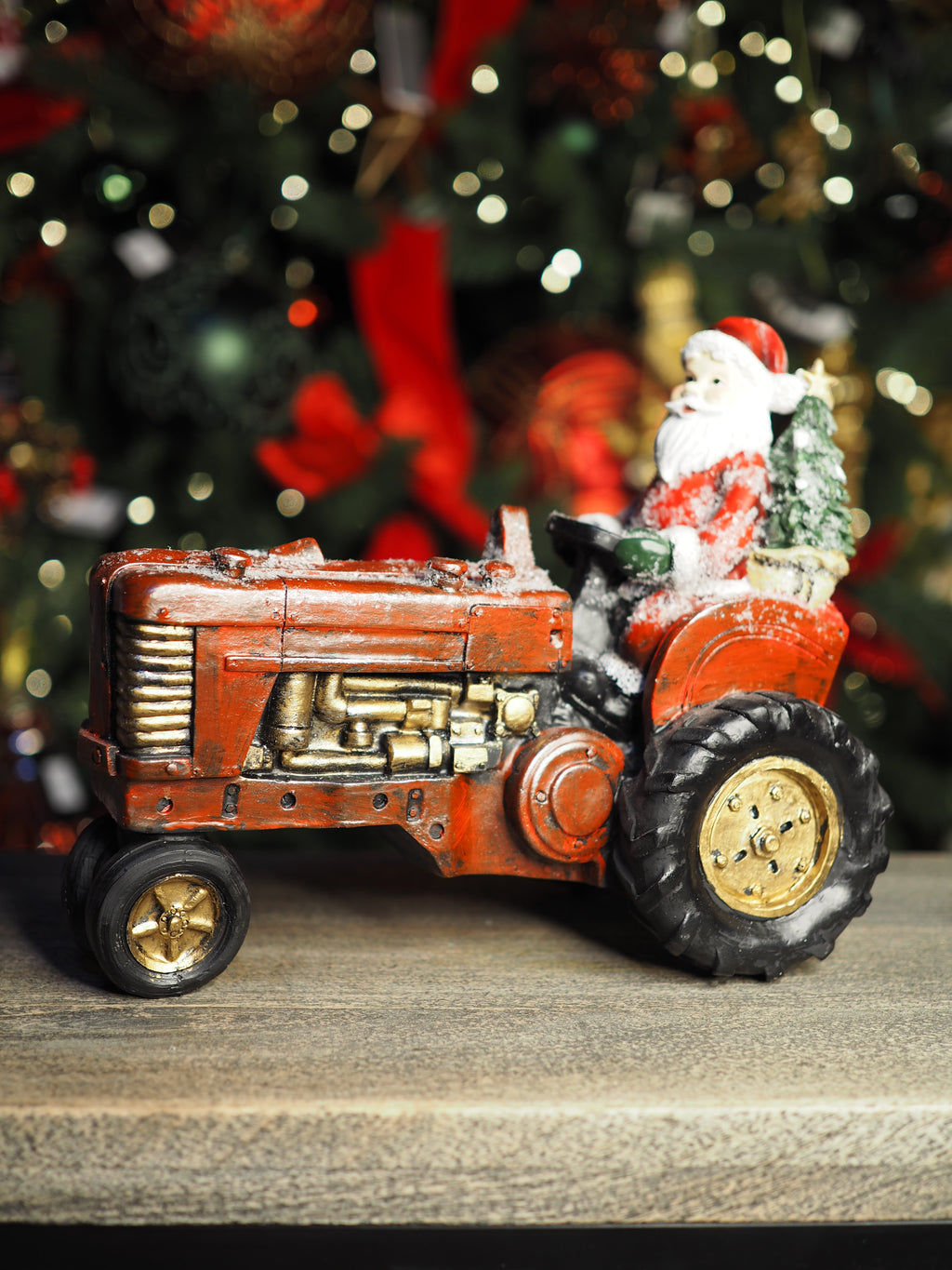 Santa on a vintage red tractor ornament