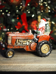 Santa on a vintage red tractor ornament