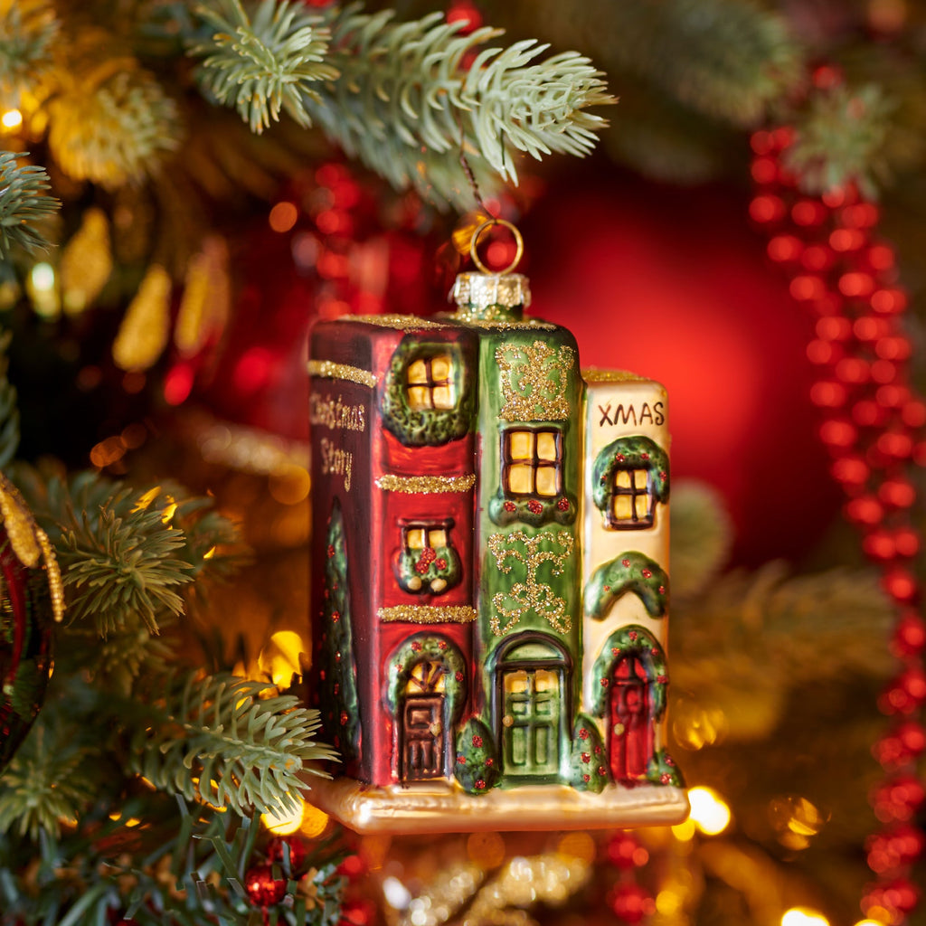 Stack of Christmas books in style of a little house