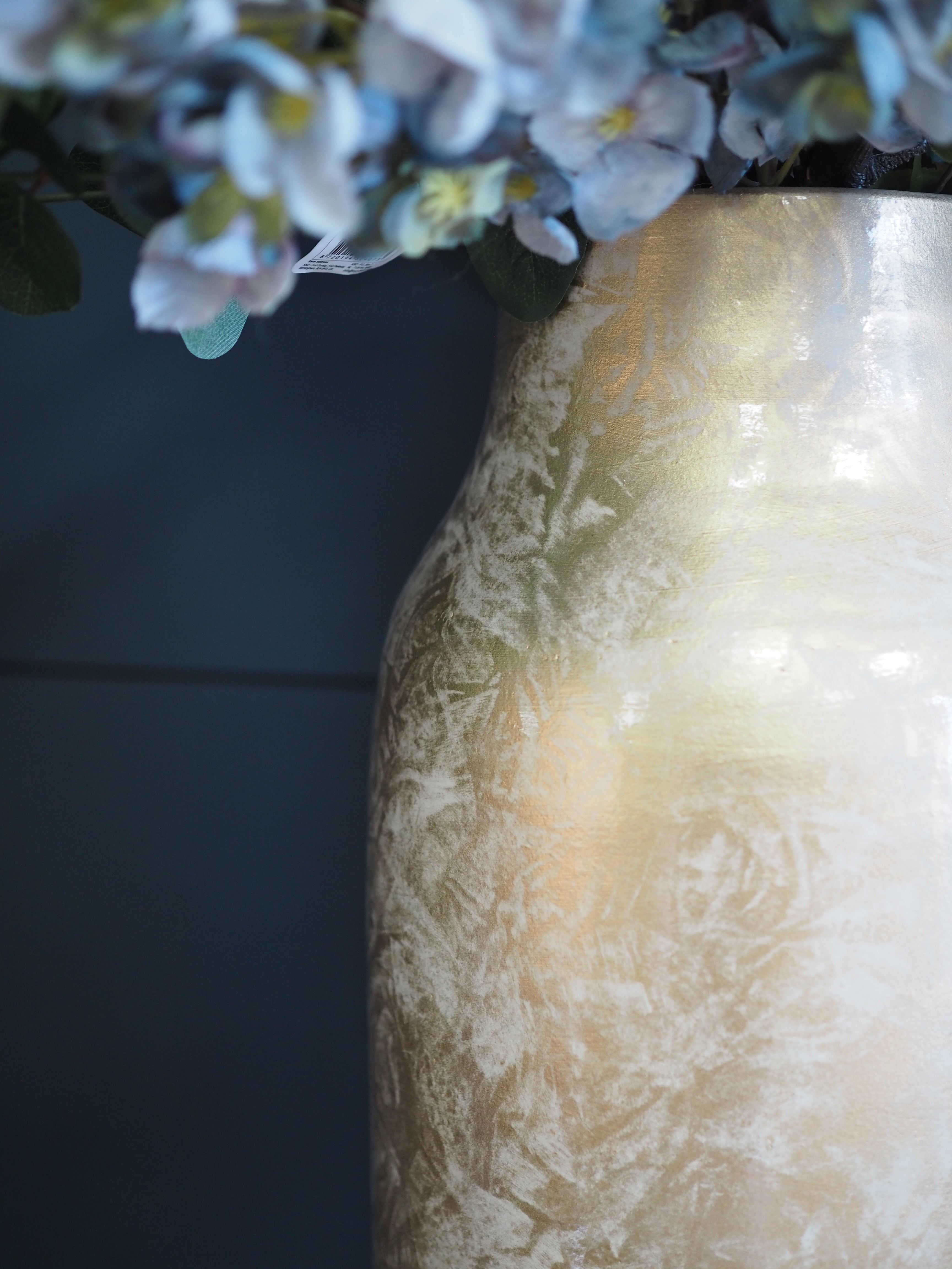Gold glazed vase with mottled effect