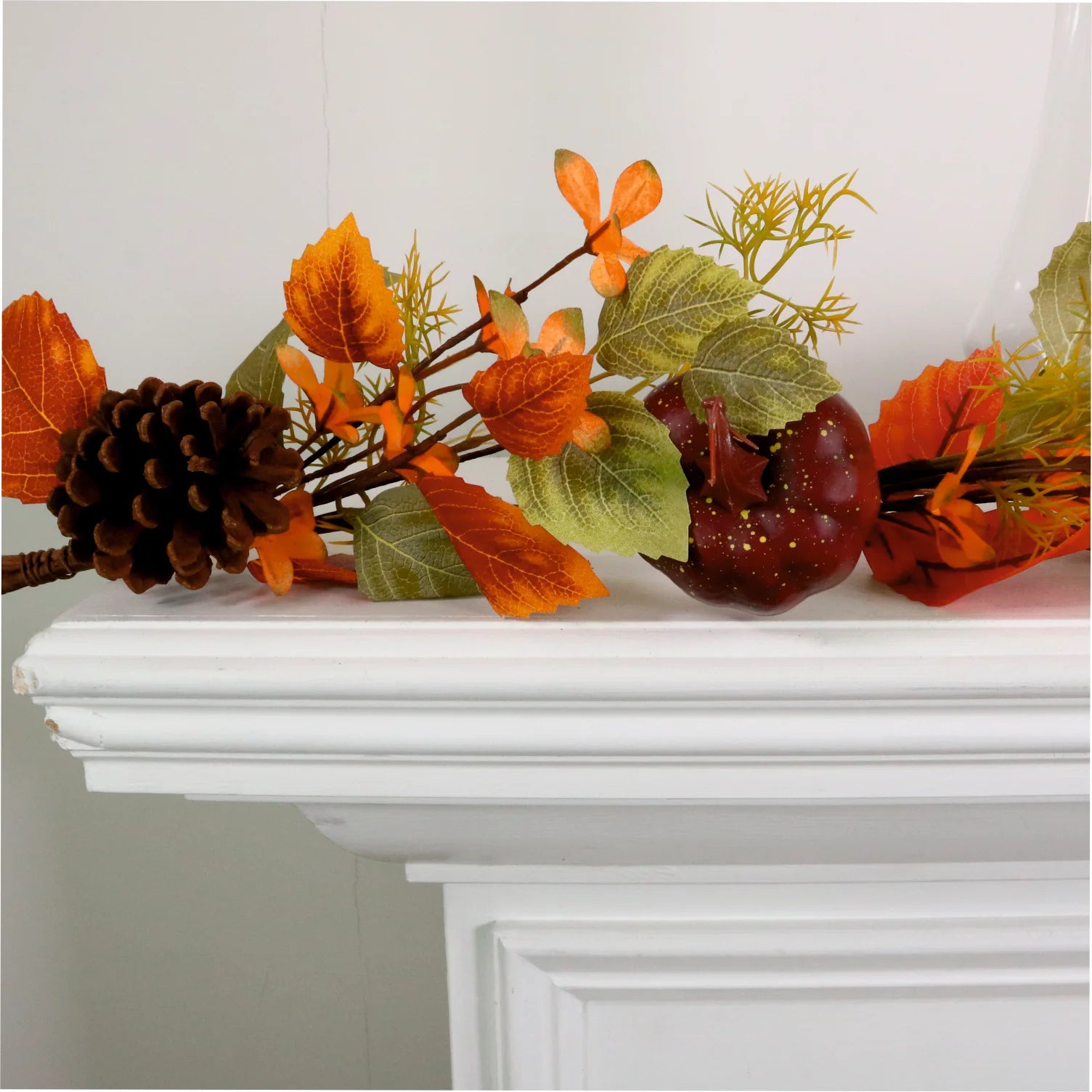 Autumn leaves, pumpkin and pine cone garland.