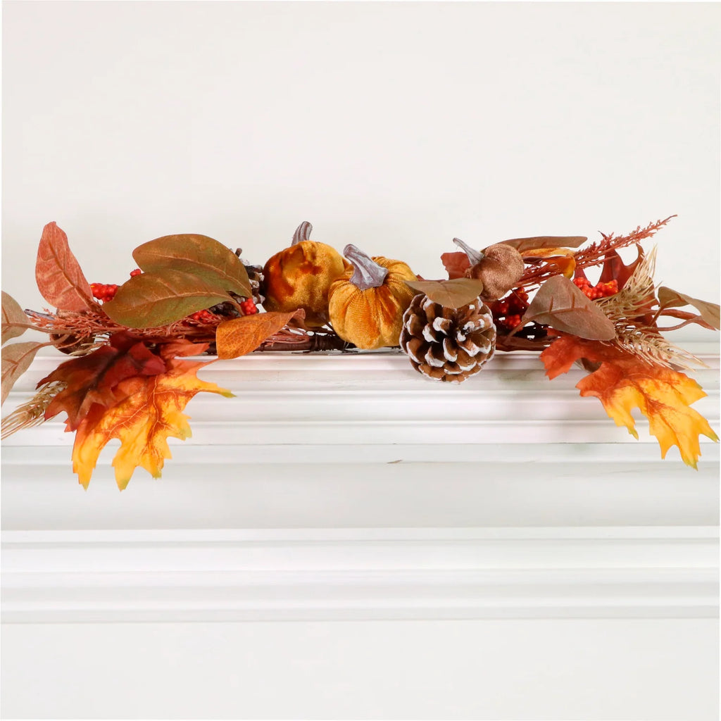 Autumn swag filled with pumpkins, pine cones and Autumn leaves