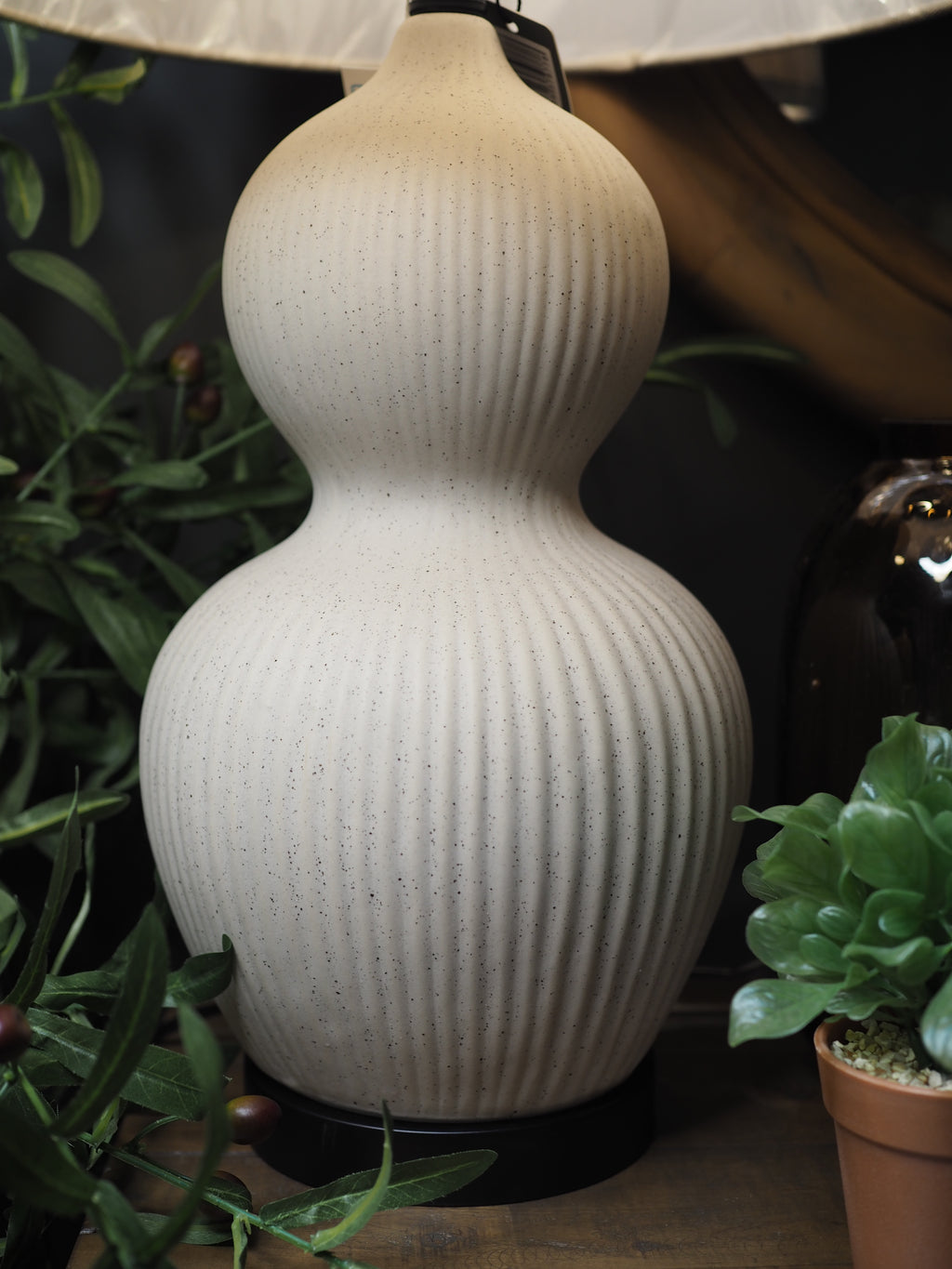Ivory ceramic lamp with oatmeal and black trim shade