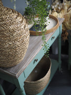 Two drawer green console table with shelf