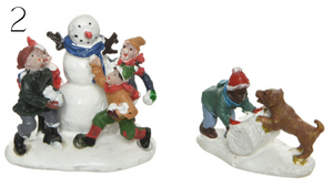 Figurines playing in the snow