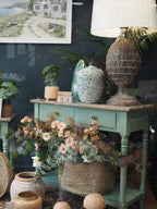 Two drawer green console table with shelf