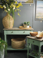 Two drawer green console table with shelf