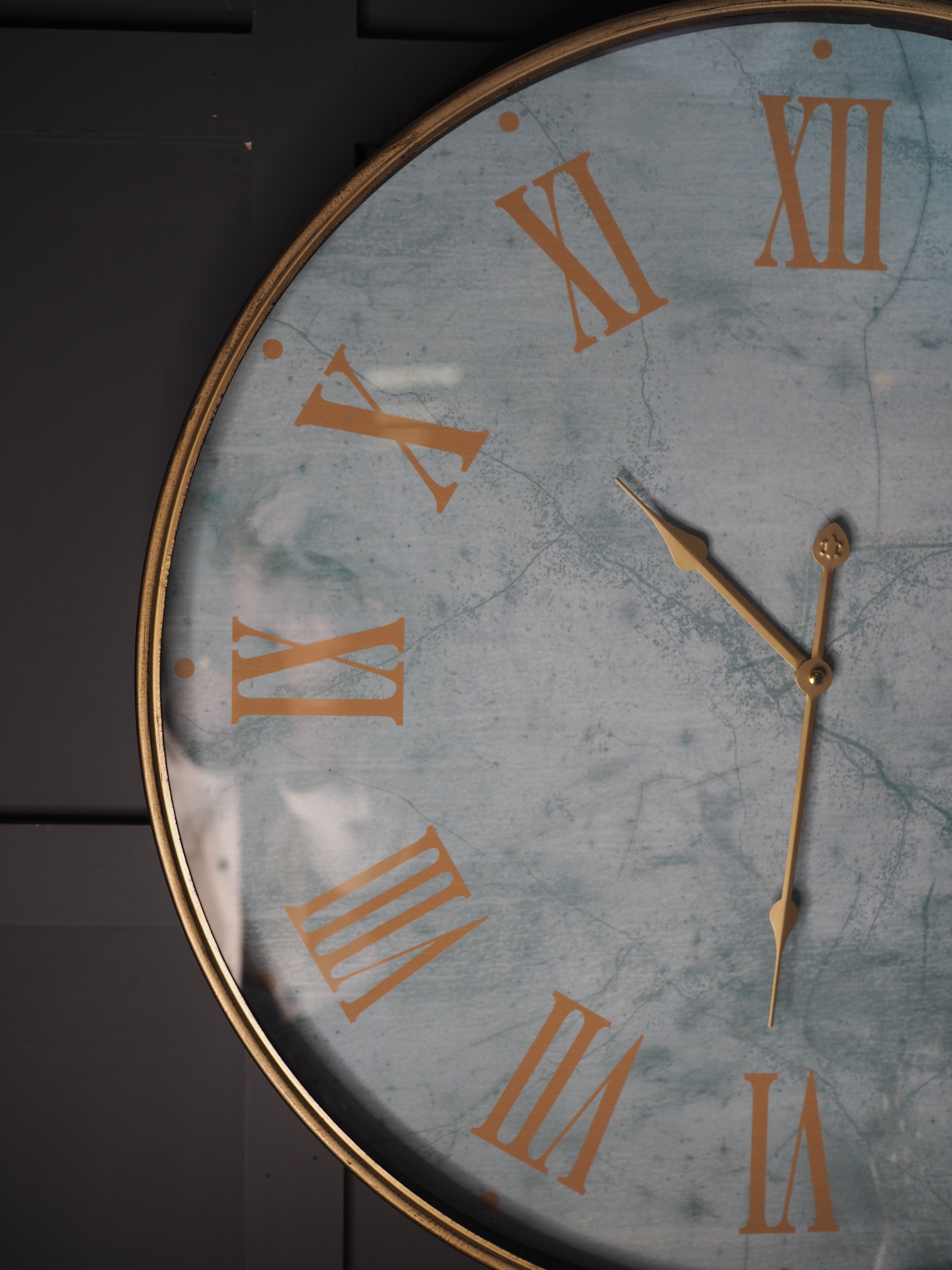 Turquoise marble face clock with gold Roman numerals