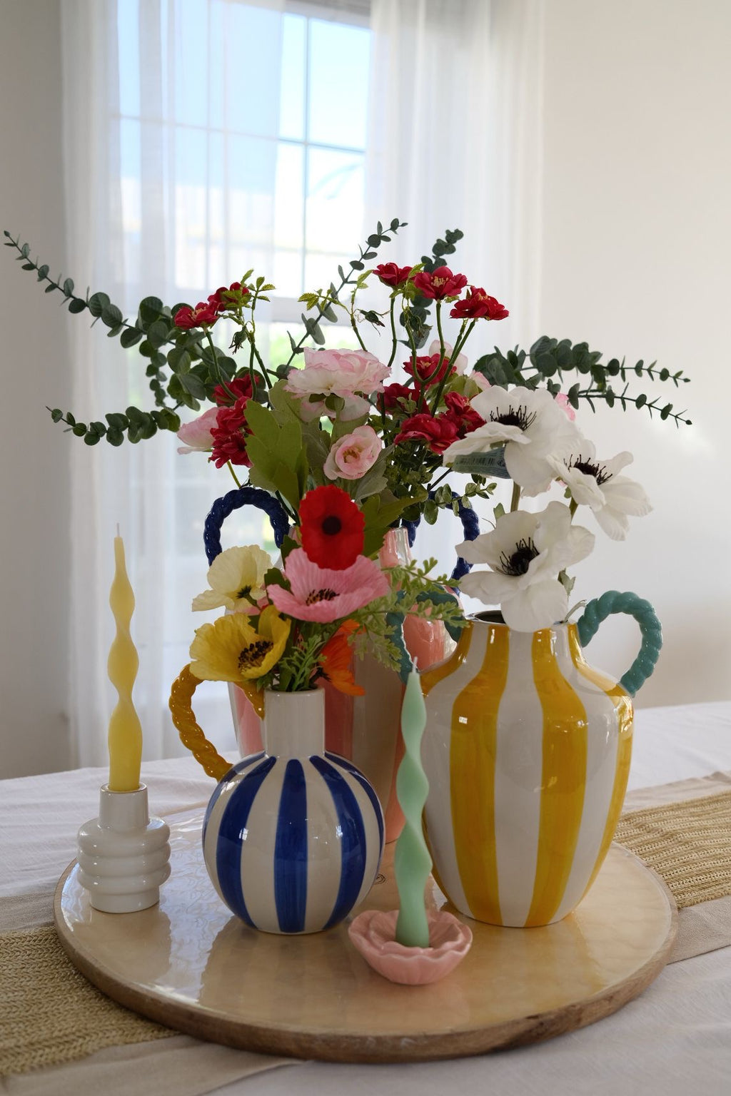 Blue & white stripe vase with yellow rope handle