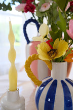 Blue & white stripe vase with yellow rope handle