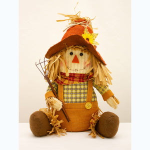 Small sitting scarecrow
