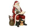 Sitting Santa ornament with bag of presents and list