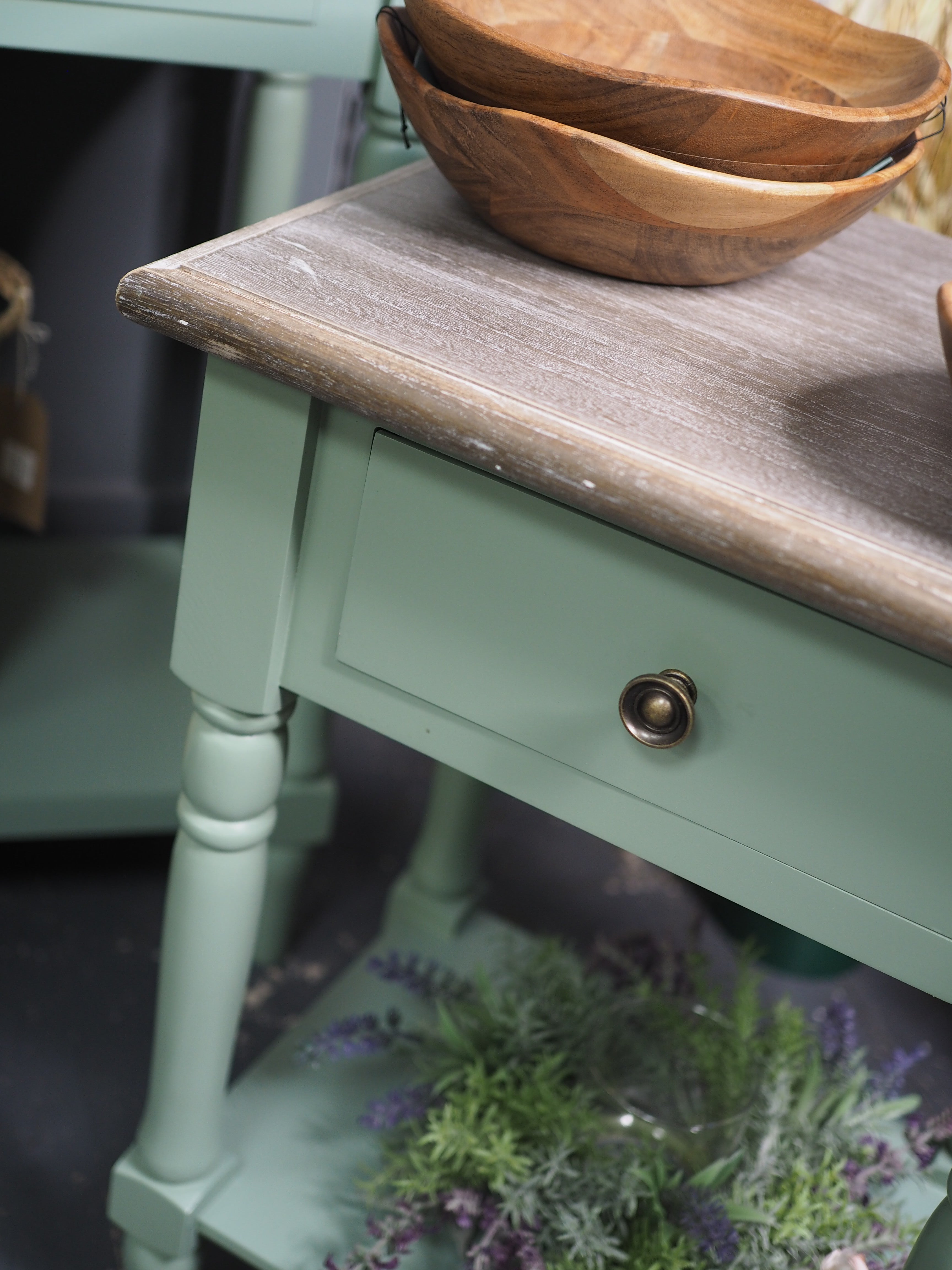 Green side table with shelf display