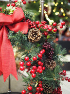 Traditional Christmas wreath with red berries and bow - large