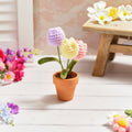 Bright and beautiful hand crocheted tulips in pot