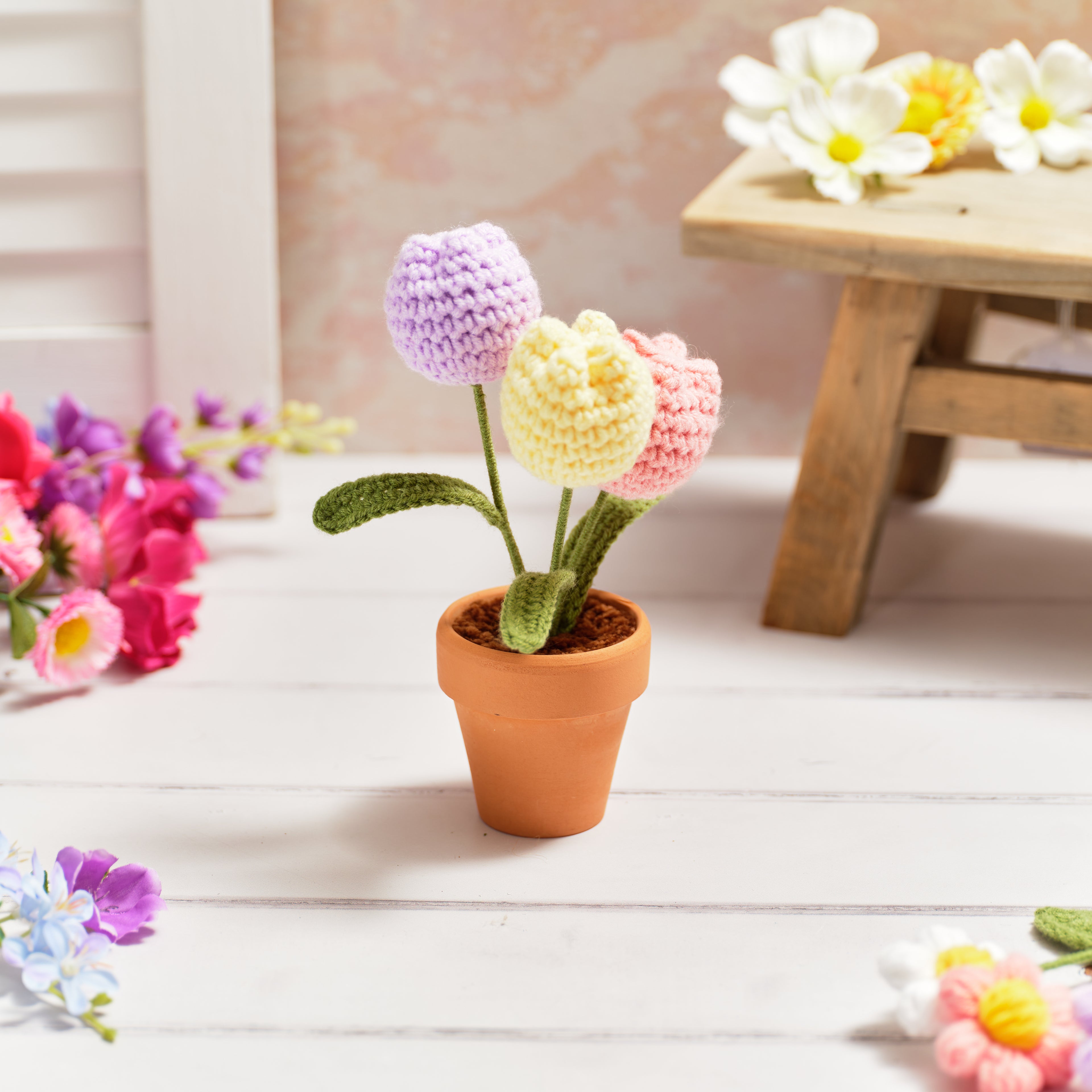 Bright and beautiful hand crocheted tulips in pot