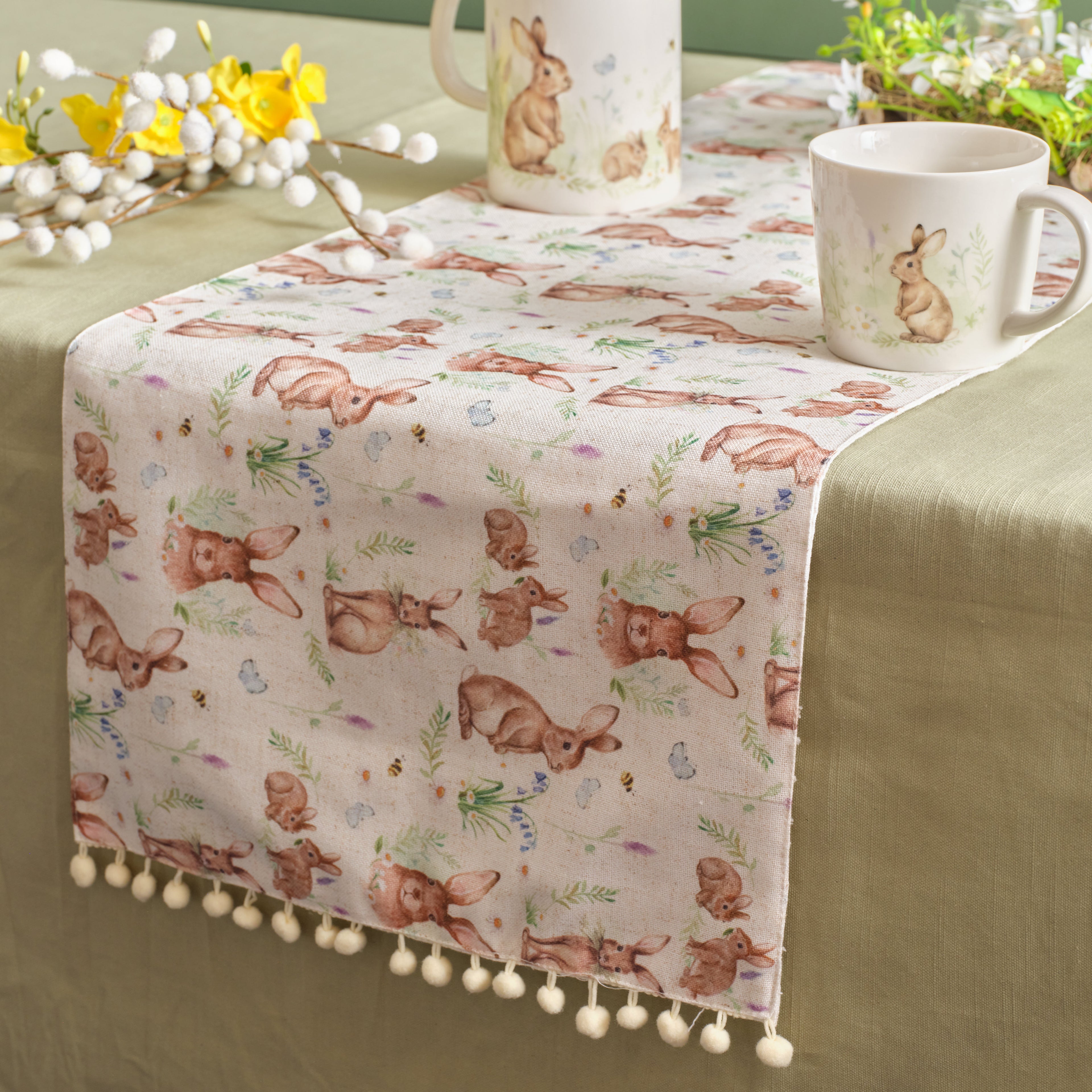 Bunny print table runner with pom pom detail