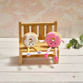 Ring doughnut shelf sitter with dangy legs