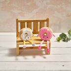 Ring doughnut shelf sitter with dangy legs