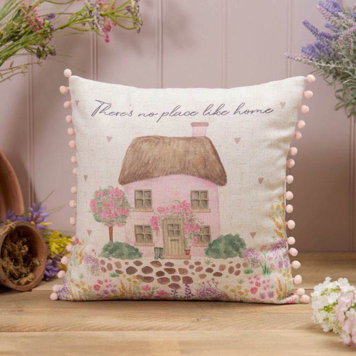 'There's no place like home' cushion with pom poms
