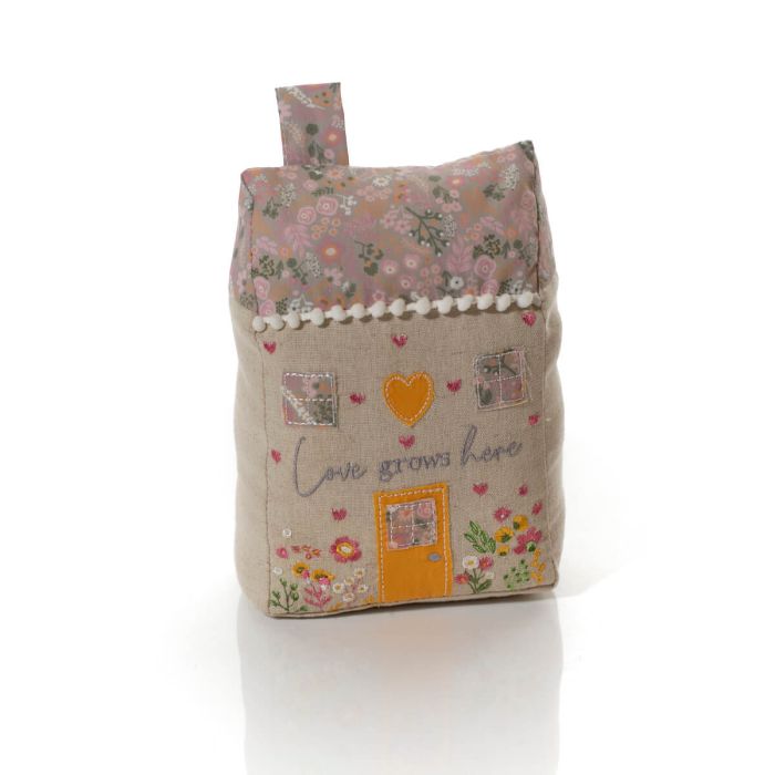 Ditsy floral 'Love Grows Here' fabric house shaped doorstop