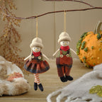 Harvest pumpkin dressed girl and boy hanging dec