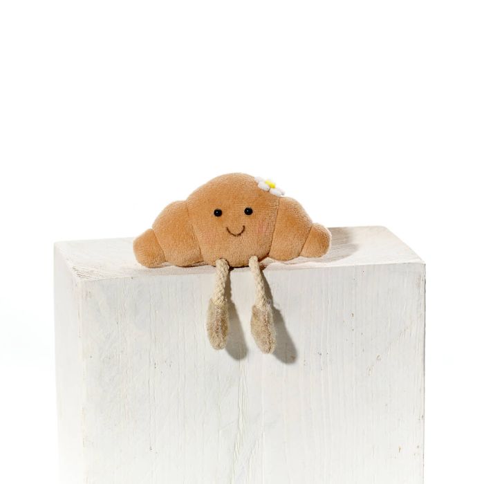 Croissant shelf sitter with dangly legs