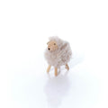 Fleecy standing sheep with wooden face
