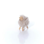 Fleecy standing sheep with wooden face