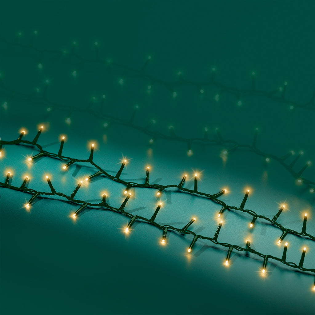 1000 LED compact soft gold lights on green cable