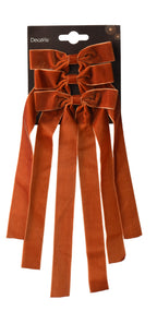 Brown/burnt orange long slim velvet bows