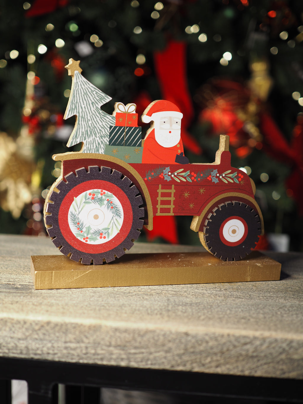 Wooden free standing Santa on a tractor dec