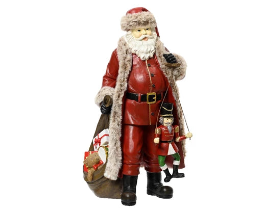 Tall vintage Santa ornament with nutcracker