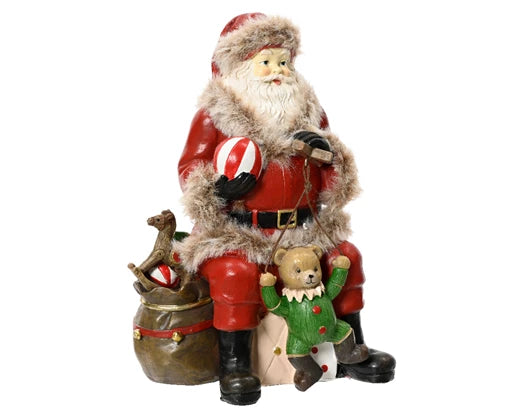 Vintage sitting Santa ornament with teddy bear and rocking horse