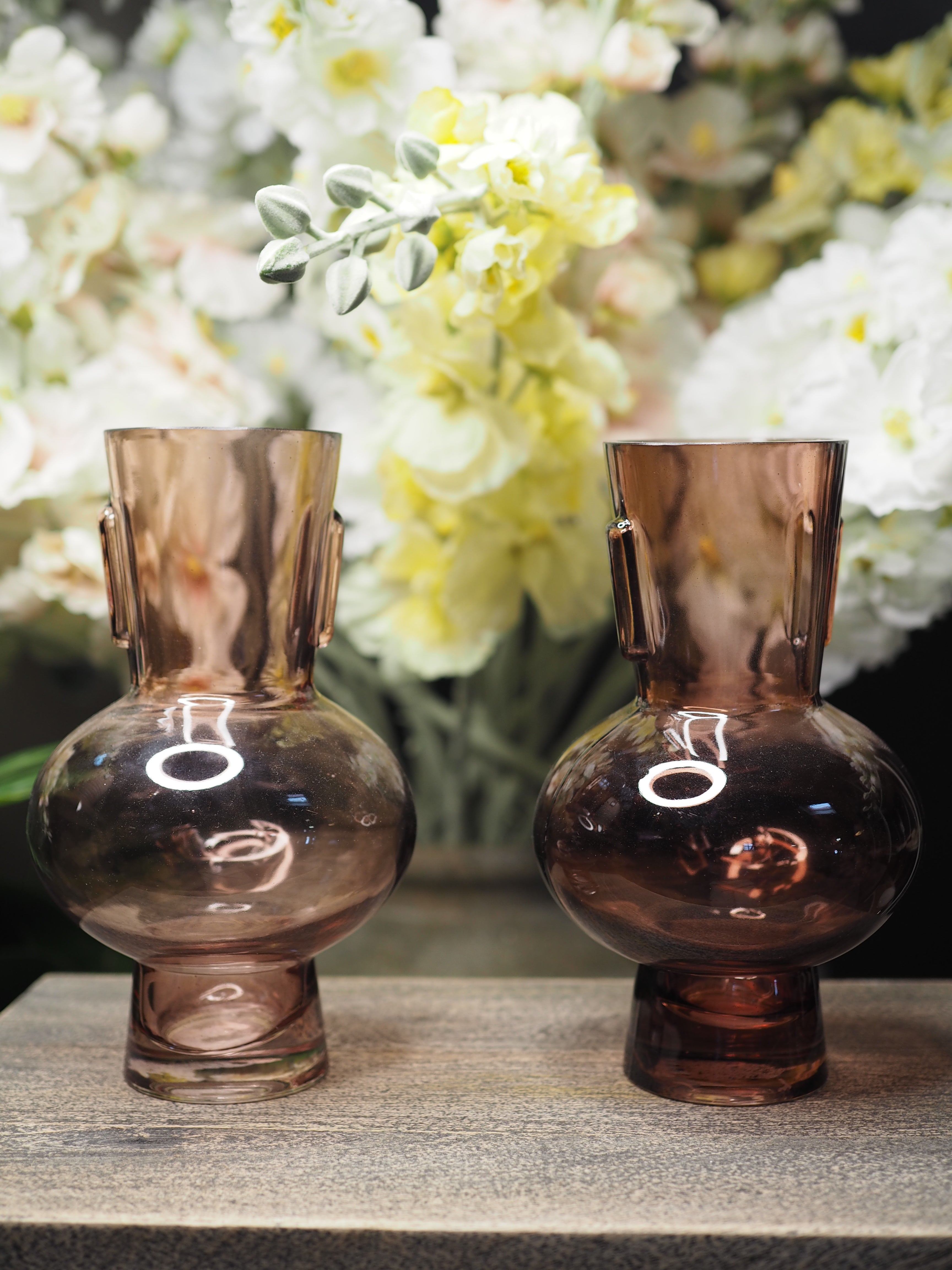 Small coloured glass vase with round base