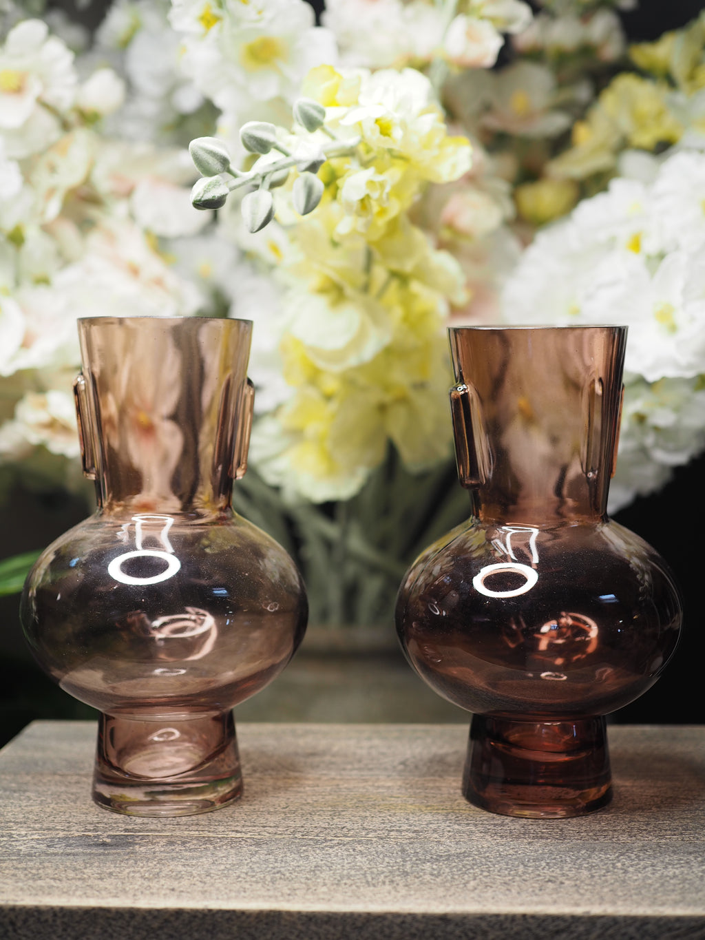 Small coloured glass vase with round base