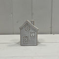 Glazed ceramic tealight house with textured detail