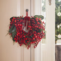 Red berry wreath with red velvet bow