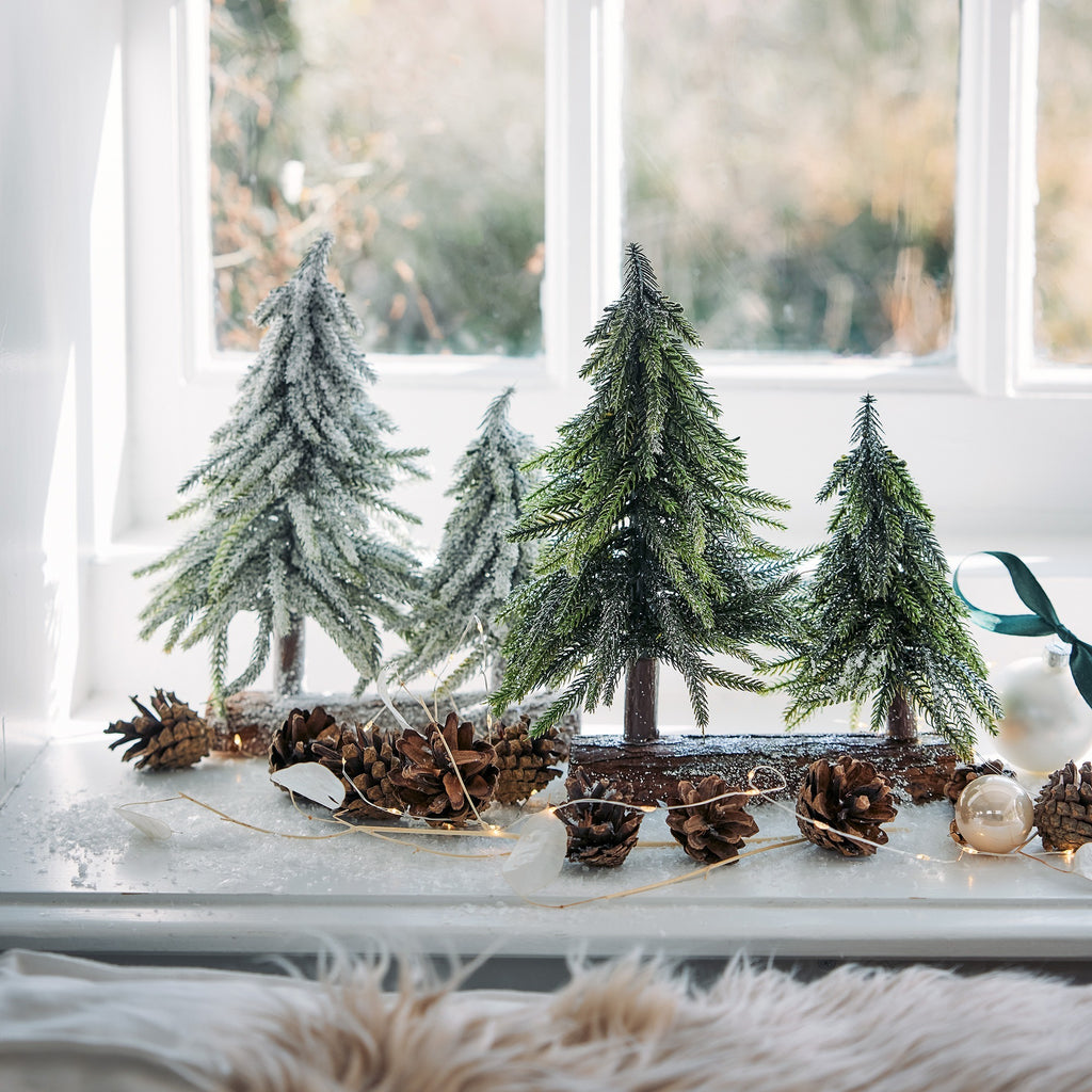 Mini glitter trees on log