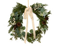 White berry and pinecone wreath with cream bow