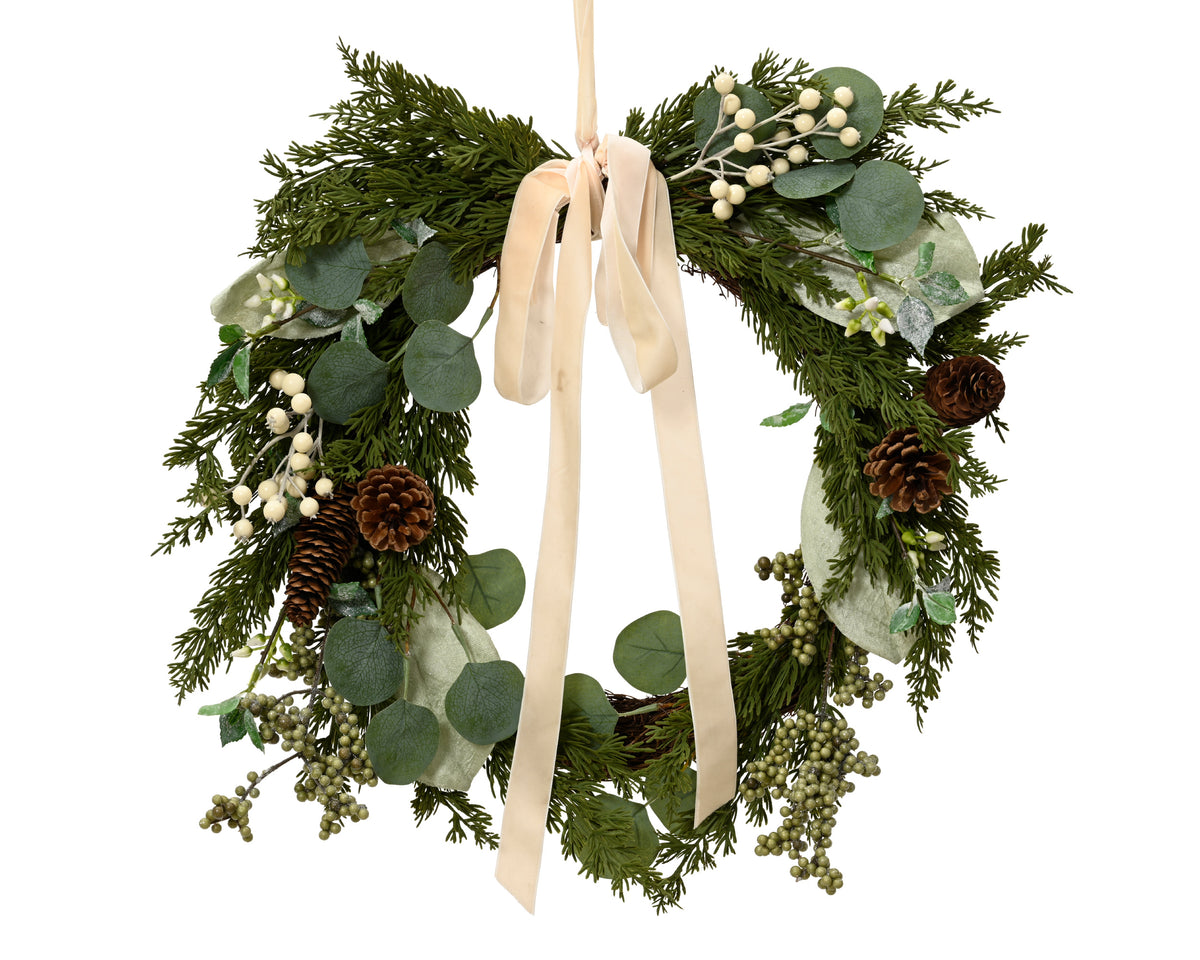 White berry and pinecone wreath with cream bow