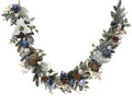 Frosted blue and silver garland with snowflake, white berries and white poinsettia
