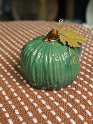 Green glossy stoneware mini pumpkin ornament with gold leaf