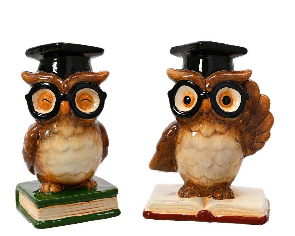 Terracotta owl with top hat perched on book