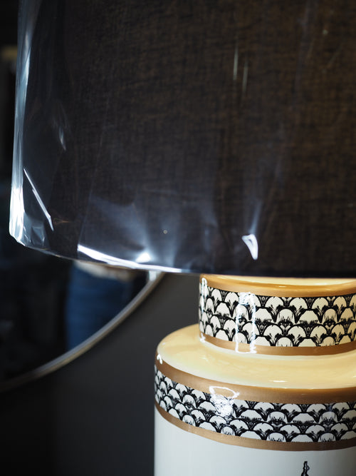 Black and white ceramic table lamp with black shade