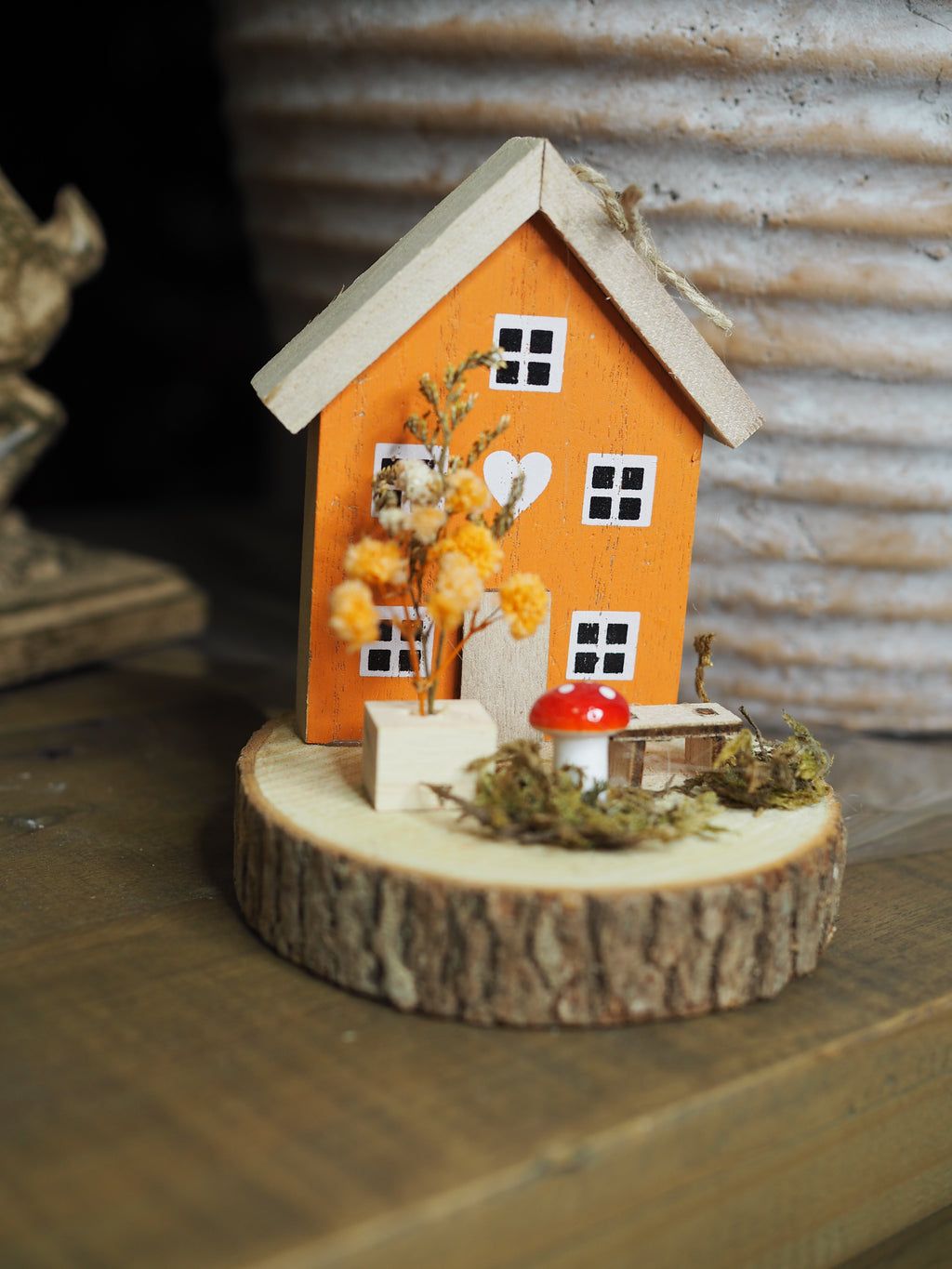 Autumnal wooden house with toadstool ornament