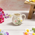 Stoneware decorative jug with 3D flowers