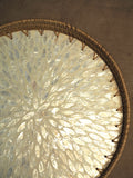 Round rattan tray with capiz detail