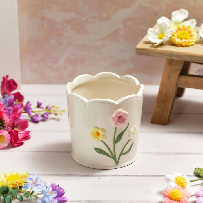 Scalloped edge planter with embossed flowers